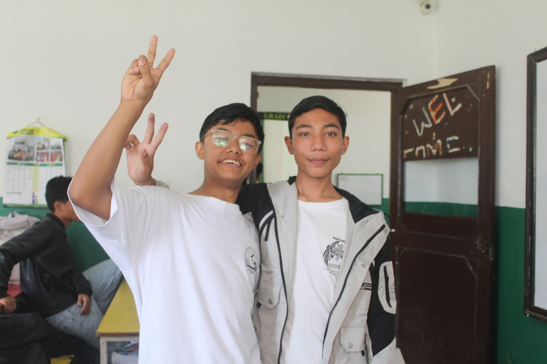 Students smiling together in a Somang classroom