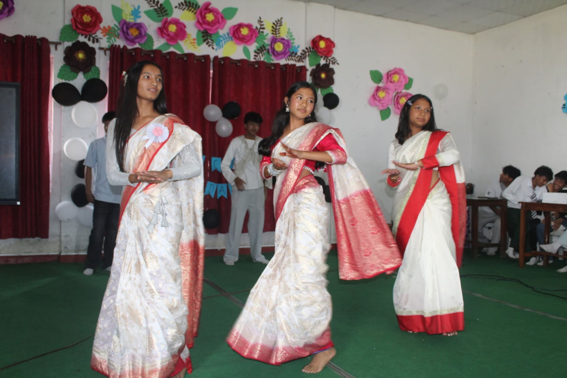 Students performing a cultural dance program at school